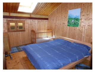 Bedroom with cot & double bed